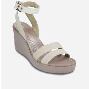 Women’s size 9 CROCS ankle strap wedge sandals.